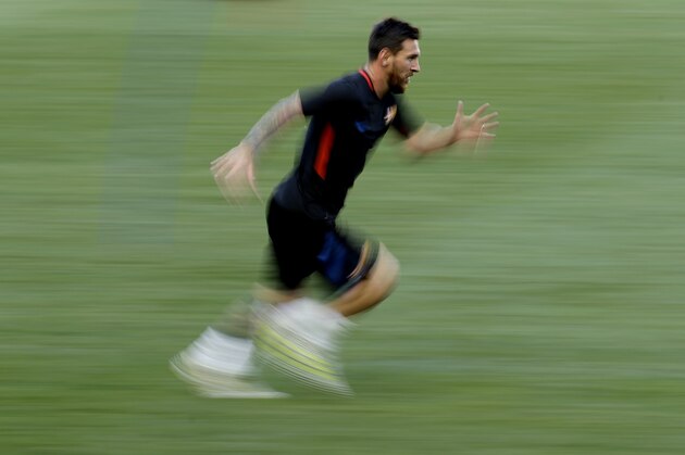 Barcelona's Lionel Messi runs a sprint while working out during a training session ahead of the team's International Champions Cup soccer match against Juventus, Friday, July 21, 2017, in Harrison, N.J. (AP Photo/Julio Cortez)