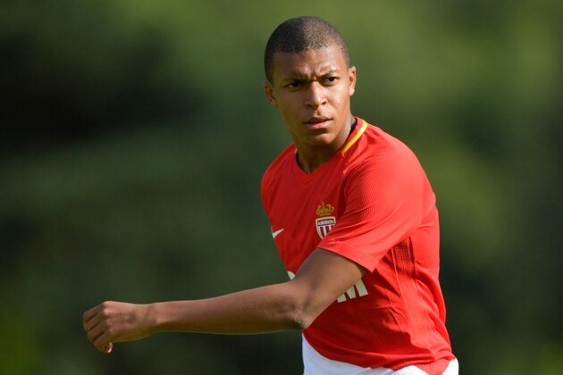 Monaco's forward Kylian Mbappe looks on during a friendly football match between AS Monaco and Stoke City FC in Martigny on July 15, 2017. / AFP PHOTO / Fabrice COFFRINI        (Photo credit should read FABRICE COFFRINI/AFP/Getty Images)