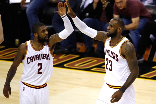 CLEVELAND, OH - JUNE 09: Kyrie Irving #2 and LeBron James #23 of the Cleveland Cavaliers celebrate after a play in the first quarter against the Golden State Warriors in Game 4 of the 2017 NBA Finals at Quicken Loans Arena on June 9, 2017 in Cleveland, Ohio. NOTE TO USER: User expressly acknowledges and agrees that, by downloading and or using this photograph, User is consenting to the terms and conditions of the Getty Images License Agreement.  (Photo by Gregory Shamus/Getty Images)