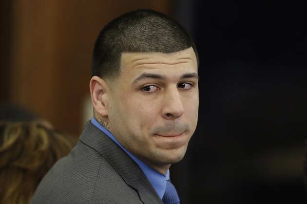 Former New England Patriots tight end Aaron Hernandez turns to look in the direction of the jury as he reacts to his double murder acquittal after the sixth day of jury deliberations at Suffolk Superior Court Friday, April 14, 2017 in Boston. Hernandez stood trial for the July 2012 killings of Daniel de Abreu and Safiro Furtado who he encountered in a Boston nightclub. The former NFL player is already serving a life sentence in the 2013 killing of semiprofessional football player Odin Lloyd. (AP Photo/Stephan Savoia, Pool)