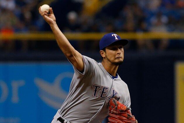 ST. PETERSBURG, FL - JULY 21:  Yu Darvish #11 of the Texas Rangers pitches during the third inning of a game against the Tampa Bay Rays on July 21, 2017 at Tropicana Field in St. Petersburg, Florida. (Photo by Brian Blanco/Getty Images)