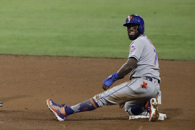 New York Mets' Jose Reyes reacts after safely stealing second base during the eighth inning of a baseball game Monday, July 24, 2017, in San Diego. The play marked Reyes' 500th career stolen base. (AP Photo/Gregory Bull)