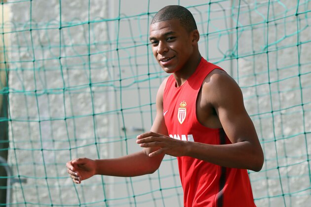 Monaco's French forward Kylian Mbappe arrives for a training session in La Turbie near Monaco on July 10, 2017. / AFP PHOTO / VALERY HACHE (Photo credit should read VALERY HACHE/AFP/Getty Images) Monaco's French forward Kylian Mbappe arrives for a training session in La Turbie near Monaco on July 10, 2017. / AFP PHOTO / VALERY HACHE (Photo credit should read VALERY HACHE/AFP/Getty Images)