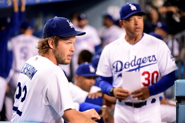 LOS ANGELES, CA - SEPTEMBER 22:  Clayton Kershaw #22 of the Los Angeles Dodgers and Manager Dave Roberts #30 look on before the game against the Colorado Rockies at Dodger Stadium on September 22, 2016 in Los Angeles, California.  (Photo by Harry How/Getty Images)