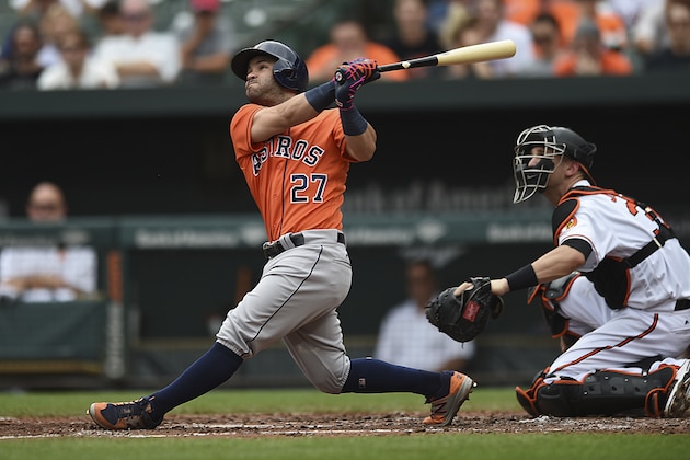 Houston Astros' Jose Altuve follows through on a three-run home run against the Baltimore Orioles in the third inning of a baseball game, Sunday, July 23, 2017, in Baltimore. (AP Photo/Gail Burton)