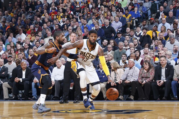 INDIANAPOLIS, IN - FEBRUARY 08: Paul George #13 of the Indiana Pacers handles the ball against Kyrie Irving #2 of the Cleveland Cavaliers during the game at Bankers Life Fieldhouse on February 8, 2017 in Indianapolis, Indiana. The Cavaliers defeated the Pacers 132-117. NOTE TO USER: User expressly acknowledges and agrees that, by downloading and or using the photograph, User is consenting to the terms and conditions of the Getty Images License Agreement. (Photo by Joe Robbins/Getty Images)