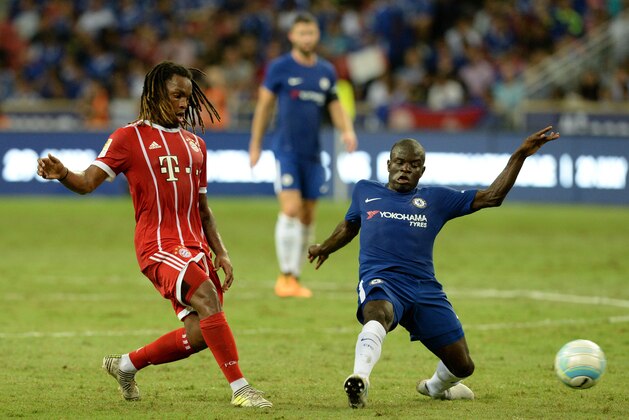 Bayern Munich's Renato Sanches (L) and Chelsea's N'Golo Kante (R) vie for the ball during the International Champions Cup football match between Chelsea and Bayern Munich in Singapore on July 25, 2017.  / AFP PHOTO / ROSLAN RAHMAN        (Photo credit should read ROSLAN RAHMAN/AFP/Getty Images)