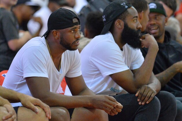 LAS VEGAS, NV - JULY 08: Chris Paul (L) and James Harden #13 of the Houston Rockets watch the action during a game between the Houston Rockets and the Cleveland Cavaliers during the 2017 Summer League at the Cox Pavilion on July 8, 2017 in Las Vegas, Nevada. NOTE TO USER: User expressly acknowledges and agrees that, by downloading and or using this photograph, User is consenting to the terms and conditions of the Getty Images License Agreement. (Photo by Sam Wasson/Getty Images)