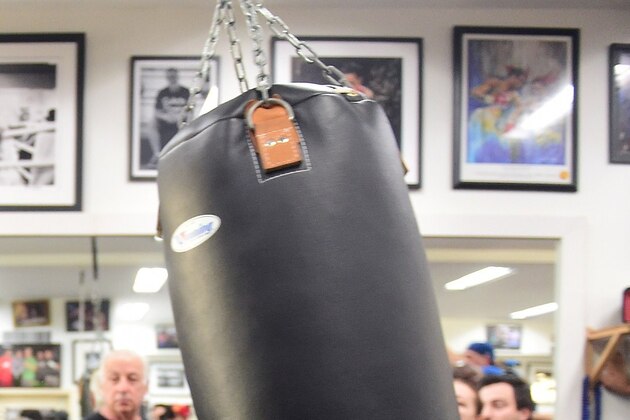Two-time Chinese Olympic gold medalist boxer Zou Shiming hits a punching bag during a workout open to the media in Hollywood, California on February 17, 2015, where he and his coach Freddy Roach met with the press. Hall of Fame trainer Freddie Roach says China's Zou Shiming must forget everything he thinks he knows about Amnat Ruenroeng if he wants to seize the Thai's flyweight world title next month. AFP PHOTO/ FREDERIC J. BROWN        (Photo credit should read FREDERIC J. BROWN/AFP/Getty Images)