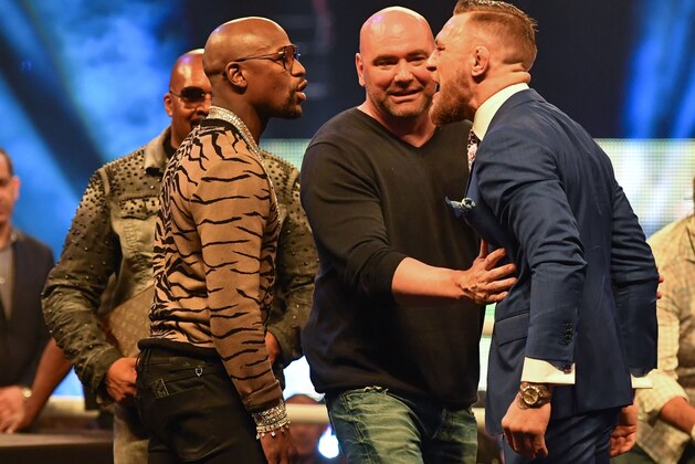 Jul 14, 2017; London, United Kingdom;  Dana White steps in as Conor McGregor and Floyd Mayweather face off during a world tour press conference to promote the upcoming Mayweather vs McGregor boxing fight at SSE Arena. Mandatory Credit: Steve Flynn-USA TODAY Sports