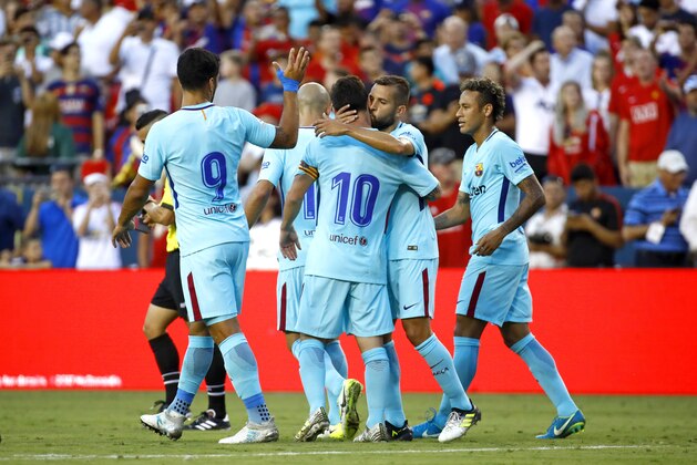 Barcelona players celebrate after Neymar, right, scored a goal during the first half of an International Champions Cup soccer match against the Manchester United, Wednesday, July 26, 2017, in Landover, Md. (AP Photo/Patrick Semansky)