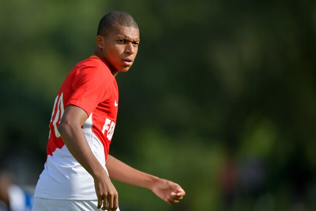Monaco's forward Kylian Mbappe looks on during a friendly football match between AS Monaco and Stoke City FC in Martigny on July 15, 2017. 
 / AFP PHOTO / Fabrice COFFRINI        (Photo credit should read FABRICE COFFRINI/AFP/Getty Images)