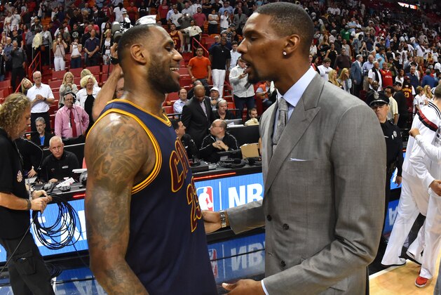 MIAMI  - MARCH 16:  LeBron James #23 of Cleveland Cavaliers greets former teammate Chris Bosh #1 after the game against the Miami Heat at the American Airlines Arena on March 16, 2015 in Miami , Florida. NOTE TO USER: User expressly acknowledges and agrees that, by downloading and or using this photograph, User is consenting to the terms and conditions of the Getty Images License Agreement. Mandatory Copyright Notice: Copyright 2015 NBAE  (Photo by Jesse D. Garrabrant / NBAE via Getty Images)