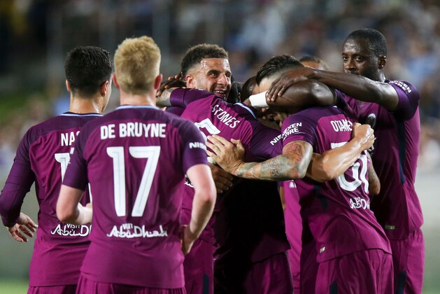 Manchester City celebrate their goal during the second half of the International Champions Cup match against Real Madrid on July 26, 2017 in Los Angeles, California. 
Manchester City won 4-1.  / AFP PHOTO / RINGO CHIU        (Photo credit should read RINGO CHIU/AFP/Getty Images)