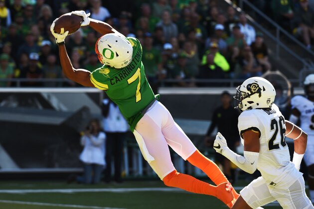 EUGENE, OR - SEPTEMBER 24: Wide receiver Darren Carrington II #7 of the Oregon Ducks catches a touchdown pass on defensive back Isaiah Oliver #26 of the Colorado Buffaloes during the second quarter of the game at Autzen Stadium on September 24, 2016 in Eugene, Oregon. (Photo by Steve Dykes/Getty Images)
