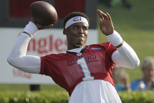 Carolina Panthers' Cam Newton looks to throw a pass during practice at training camp at Wofford College in Spartanburg, S.C., Wednesday, July 26, 2017. (AP Photo/Chuck Burton)