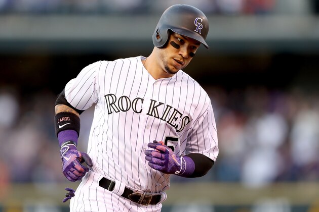DENVER, CO - JUNE 06:  Carlos Gonzalez #5 of the Colorado Rockies circles the bases after hitting a 2 RBI home run in the third inning against the Cleveland Indians at Coors Field on June 6, 2017 in Denver, Colorado.  (Photo by Matthew Stockman/Getty Images)