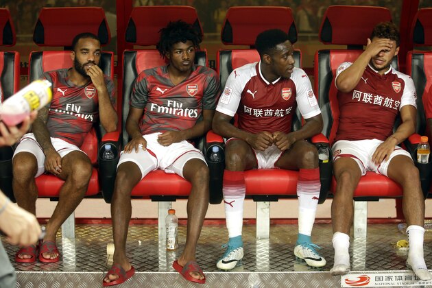 Arsenal players sit on the bench after their friendly soccer match against Chelsea in Beijing, Saturday, July 22, 2017. Chelsea beat Arsenal 3-0. (AP Photo/Mark Schiefelbein)