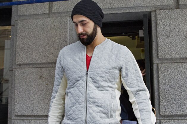 Atlanta Hawks NBA basketball player Pero Antic leaves a courthouse in New York, Wednesday, April 8, 2015. Antic and teammate Thabo Sefolosha have been released after their arrest on charges they blocked officers from setting up a crime scene following the stabbing of Indiana Pacers' Chris Copeland. (AP Photo/Craig Ruttle)