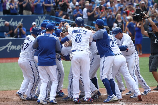 TORONTO, ON - JULY 27: Steve Pearce #28 of the Toronto Blue Jays is congratulated by teammates at home plate after hitting a game-winning grand slam home run in the tenth inning during MLB game action against the Oakland Athletics at Rogers Centre on July 27, 2017 in Toronto, Canada. (Photo by Tom Szczerbowski/Getty Images) TORONTO, ON - JULY 27: Steve Pearce #28 of the Toronto Blue Jays is congratulated by teammates at home plate after hitting a game-winning grand slam home run in the tenth inning during MLB game action against the Oakland Athletics at Rogers Centre on July 27, 2017 in Toronto, Canada. (Photo by Tom Szczerbowski/Getty Images)