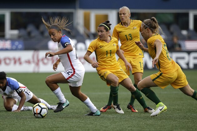 U.S. forward Mallory Pugh, second from left, moves the ball away from Australia's Lisa De Vanna (11), Tameka Butt (13) and Elise Kellond-Knight (8) during the first half of a Tournament of Nations women's soccer match, Thursday, July 27, 2017, in Seattle. (AP Photo/Ted S. Warren)