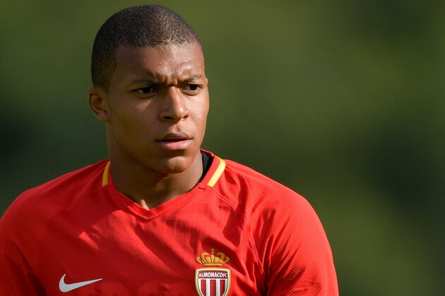 Monaco's forward Kylian Mbappe warms up during a friendly football match between AS Monaco and Stoke City FC in Martigny on July 15, 2017. 
 / AFP PHOTO / Fabrice COFFRINI        (Photo credit should read FABRICE COFFRINI/AFP/Getty Images)