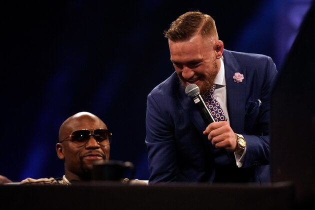 LONDON, ENGLAND - JULY 14:  (R-L) Conor McGregor taunts Floyd Mayweather Jr. during the Floyd Mayweather Jr. v Conor McGregor World Press Tour event at SSE Arena on July 14, 2017 in London, England. (Photo by Jeff Bottari/Zuffa LLC/Zuffa LLC via Getty Images)