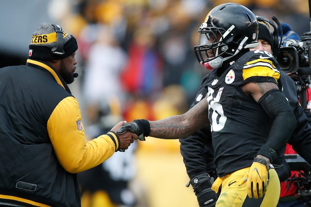 PITTSBURGH, PA - JANUARY 08:  Le'Veon Bell #26 of the Pittsburgh Steelers celebrates with head coach Mike Tomlin  after scoring a touchdown during the second quarter against the Miami Dolphins in the AFC Wild Card game at Heinz Field on January 8, 2017 in Pittsburgh, Pennsylvania.  (Photo by Gregory Shamus/Getty Images)