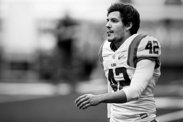 SYRACUSE, NY - SEPTEMBER 26:  Colby Delahoussaye #42 of the LSU Tigers warms up before the game against the Syracuse Orange on September 26, 2015 at The Carrier Dome in Syracuse, New York.  LSU defeats Syracuse 34-24.  (Photo by Brett Carlsen/Getty Images)