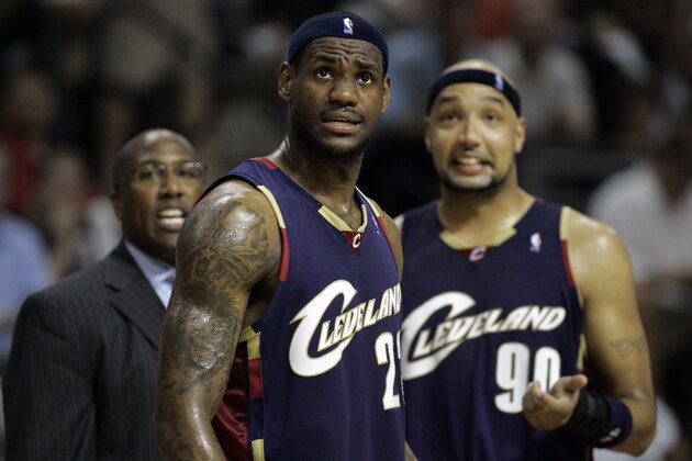 Cleveland Cavaliers forwards LeBron James, center, and Drew Gooden (90) and coach Mike Brown look from the sidelines during a timeout in the third quarter of Game 5 of the NBA Eastern Conference basketball finals against the Detroit Pistons at the Palace of Auburn Hills, Mich., Thursday, May 31, 2007. (AP Photo/Paul Sancya)