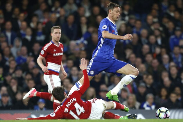 Chelsea's Serbian midfielder Nemanja Matic (R) skips a tackle by Middlesbrough's Dutch midfielder Marten de Roon during the English Premier League football match between Chelsea and Middlesbrough at Stamford Bridge in London on May 8, 2017. / AFP PHOTO / Ian KINGTON / RESTRICTED TO EDITORIAL USE. No use with unauthorized audio, video, data, fixture lists, club/league logos or 'live' services. Online in-match use limited to 75 images, no video emulation. No use in betting, games or single club/league/player publications.  /         (Photo credit should read IAN KINGTON/AFP/Getty Images)