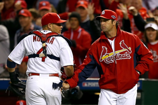 ST LOUIS, MO - OCTOBER 17: Yadier Molina #4 talks with manager Mike Matheny #22 of the St. Louis Cardinals after Molina catches a foul ball to end the eighth inning against the San Francisco Giants in Game Three of the National League Championship Series at Busch Stadium on October 17, 2012 in St Louis, Missouri. (Photo by Elsa/Getty Images) ST LOUIS, MO - OCTOBER 17: Yadier Molina #4 talks with manager Mike Matheny #22 of the St. Louis Cardinals after Molina catches a foul ball to end the eighth inning against the San Francisco Giants in Game Three of the National League Championship Series at Busch Stadium on October 17, 2012 in St Louis, Missouri. (Photo by Elsa/Getty Images)