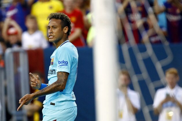 Barcelona's Neymar gestures after scoring a goal during the first half of an International Champions Cup soccer match against the Manchester United, Wednesday, July 26, 2017, in Landover, Md. (AP Photo/Patrick Semansky)