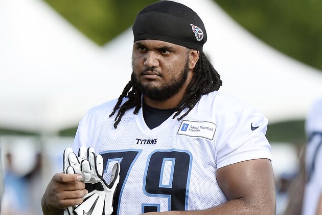 FILE -- In this July 31, 2016 file photo, Tennessee Titans offensive guard Sebastian Tretola leaves the field after NFL football training camp in Nashville, Tenn. A man has filed a federal lawsuit alleging Tretola acted as a lookout as Titans wide receiver Tajae Sharpe beat him up in an alley behind a Nashville bar the night of the NFL draft. Dante R. Satterfield filed the lawsuit filed Wednesday, May 10, 2017. in U.S. District Court. (AP Photo/Mark Zaleski)