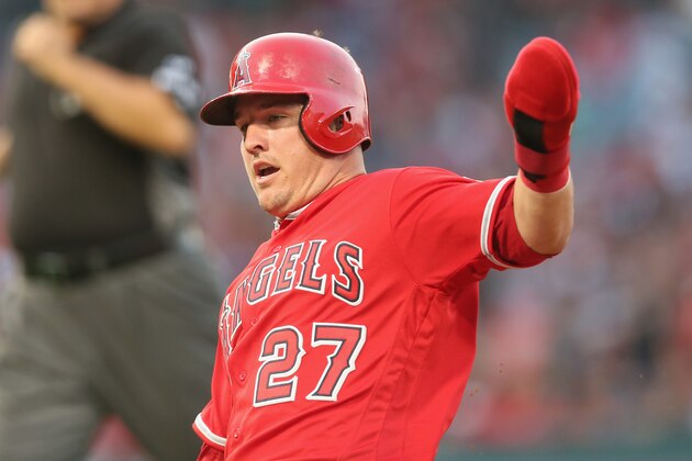 ANAHEIM, CALIFORNIA - JULY 15: Mike Trout #27 of the Los Angeles Angels of Anaheim slides back into first base after an Albert Pujols fly ball out as he wears a protective glove over his hand against the Tampa Bay Rays at Angel Stadium of Anaheim on July 15, 2017 in Anaheim, California. (Photo by Stephen Dunn/Getty Images) ANAHEIM, CALIFORNIA - JULY 15: Mike Trout #27 of the Los Angeles Angels of Anaheim slides back into first base after an Albert Pujols fly ball out as he wears a protective glove over his hand against the Tampa Bay Rays at Angel Stadium of Anaheim on July 15, 2017 in Anaheim, California. (Photo by Stephen Dunn/Getty Images)