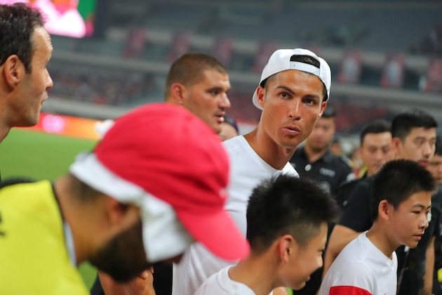 Real Madrid player Christiano Ronaldo attends an event as part of his individual promotional tour of China, in Shanghai on July 22, 2017. / AFP PHOTO / STR / China OUT (Photo credit should read STR/AFP/Getty Images) Real Madrid player Christiano Ronaldo attends an event as part of his individual promotional tour of China, in Shanghai on July 22, 2017. / AFP PHOTO / STR / China OUT (Photo credit should read STR/AFP/Getty Images)