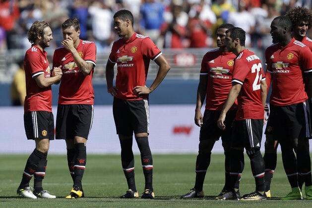 Manchester United's Daley Blind, left, celebrates after scoring during a shootout against Real Madrid in the second half of an international friendly soccer match, Sunday, July 23, 2017, in Santa Clara, Calif. (AP Photo/Ben Margot)