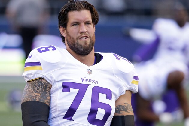 Minnesota Vikings offensive guard Alex Boone stretches during warmups before a preseason NFL football game against the Seattle Seahawks, Thursday, Aug. 18, 2016, in Seattle. (AP Photo/Elaine Thompson)