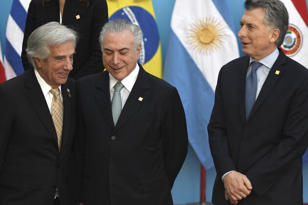 Uruguayan president Tabare Vazquez (L), Brazilian president Michel Temer (C) and Argentine President Mauricio Macri arrive to pose for the official picture at the end of the Mercosur Summit in mendoza, 1080 km west of buenos Aires on July 21, 2017. / AFP PHOTO / Andres Larrovere        (Photo credit should read ANDRES LARROVERE/AFP/Getty Images)