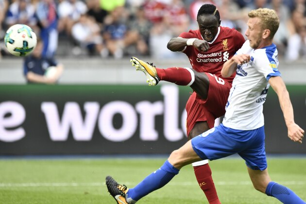 Berlin's Swiss defender Fabian Lustenberger (R) and Liverpool's Senegalese midfielder Sadio Mane vie for the ball during a friendly football match Hertha Berlin vs Liverpool in Berlin, Germany, on July 29, 2017.  / AFP PHOTO / John MACDOUGALL        (Photo credit should read JOHN MACDOUGALL/AFP/Getty Images)