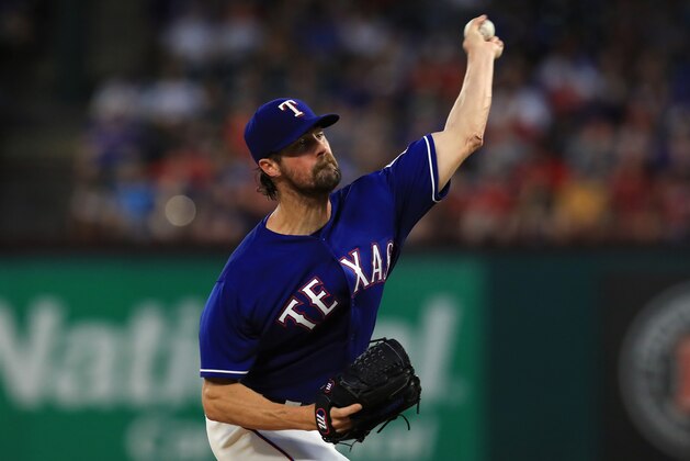 ARLINGTON, TX - JULY 25:  Cole Hamels #35 of the Texas Rangers throws against the Miami Marlins in the fifth inning at Globe Life Park in Arlington on July 25, 2017 in Arlington, Texas.  (Photo by Ronald Martinez/Getty Images)