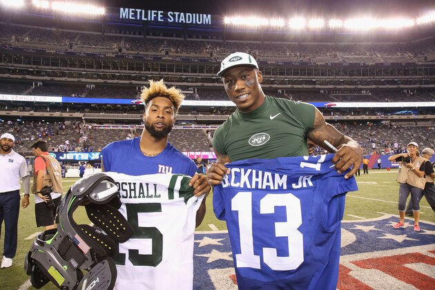 EAST RUTHERFORD, NJ - AUGUST 29:  Wide Receiver Brandon Marshall #15 of the New York Jets and Wide Receiver Odell Beckham, Jr. #13 the New York Giants exchange jerseys at MetLife Stadium on August 29, 2015 in East Rutherford, New Jersey.  (Photo by Al Pereira/Getty Images for New York Jets)