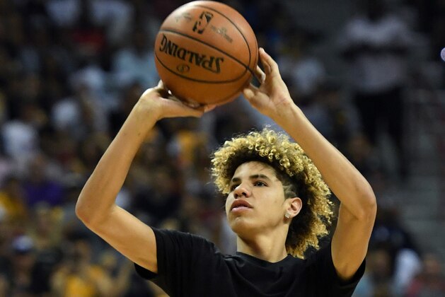 LAS VEGAS, NV - JULY 07: LaMelo Ball, brother of Lonzo Ball #2 of the Los Angeles Lakers, shoots baskets as part of a promotion during a timeout of a 2017 Summer League game between the Lakers and the Los Angeles Clippers at the Thomas & Mack Center on July 7, 2017 in Las Vegas, Nevada. The Clippers won 96-93 in overtime. NOTE TO USER: User expressly acknowledges and agrees that, by downloading and or using this photograph, User is consenting to the terms and conditions of the Getty Images License Agreement. (Photo by Ethan Miller/Getty Images) LAS VEGAS, NV - JULY 07: LaMelo Ball, brother of Lonzo Ball #2 of the Los Angeles Lakers, shoots baskets as part of a promotion during a timeout of a 2017 Summer League game between the Lakers and the Los Angeles Clippers at the Thomas & Mack Center on July 7, 2017 in Las Vegas, Nevada. The Clippers won 96-93 in overtime. NOTE TO USER: User expressly acknowledges and agrees that, by downloading and or using this photograph, User is consenting to the terms and conditions of the Getty Images License Agreement. (Photo by Ethan Miller/Getty Images)