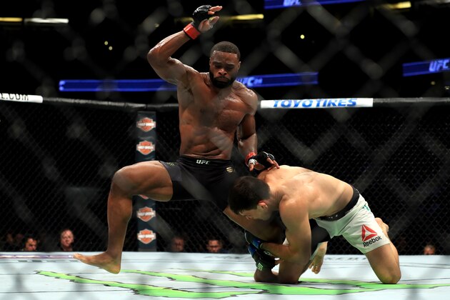 ANAHEIM, CA - JULY 29:  Tyron Woodley (black shorts) fights Demian Maia of Brazil in the Welterweight title bout  during UFC 214 at Honda Center on July 29, 2017 in Anaheim, California.  (Photo by Sean M. Haffey/Getty Images)