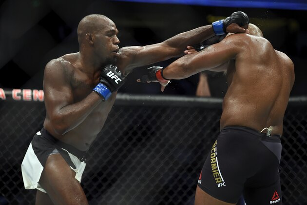 ANAHEIM, CA - JULY 29:  (L-R) Jon Jones punches Daniel Cormier in their UFC light heavyweight championship bout during the UFC 214 event inside the Honda Center on July 29, 2017 in Anaheim, California. (Photo by Jeff Bottari/Zuffa LLC/Zuffa LLC via Getty Images)