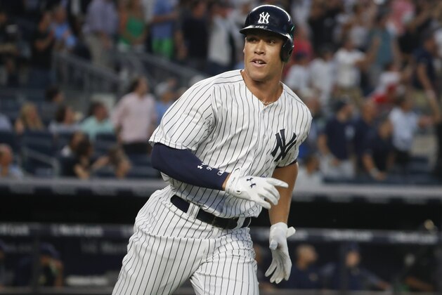 New York Yankees' Aaron Judge looks back at the dugout as he heads up the first base line after hitting a solo home run against the Tampa Bay Rays during the fourth inning of a baseball game, Friday, July 28, 2017, in New York. (AP Photo/Julie Jacobson)