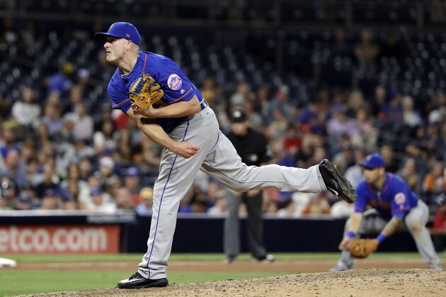 New York Mets closing pitcher Addison Reed works against a San Diego Padres batter during the ninth inning of a baseball game Tuesday, July 25, 2017, in San Diego. The Mets won 6-5. (AP Photo/Gregory Bull)