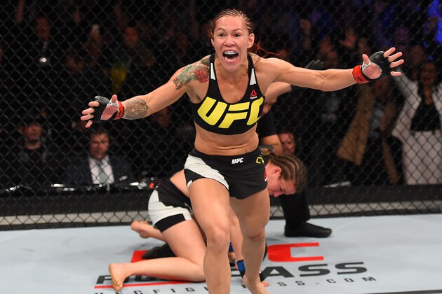 CURITIBA, BRAZIL - MAY 14:  (L-R) Cristiane 'Cyborg' Justino of Brazil celebrates after defeating Leslie Smith in their women's catchweight bout during the UFC 198 event at Arena da Baixada stadium on May 14, 2016 in Curitiba, Parana, Brazil.  (Photo by Josh Hedges/Zuffa LLC/Zuffa LLC via Getty Images)