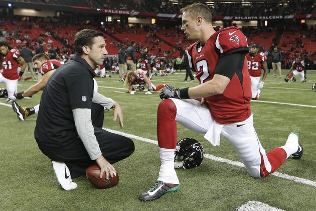 Atlanta Falcons quarterback Matt Ryan (2) speaks with Offensive Coordinator Kyle Shanahan before the first half of an NFL football game between the Atlanta Falcons and the Kansas City Chiefs, Sunday, Dec. 4, 2016, in Atlanta. (AP Photo/John Bazemore)
