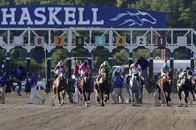 The horses leave the starting gate during the Haskell Invitational horse race at Monmouth Park in Oceanport, N.J., Sunday, Aug. 2, 2015. Jockey Victor Espinoza, third right, on Triple Crown winner American Pharoah won. Keen Ice  was second. (AP Photo/Mel Evans)